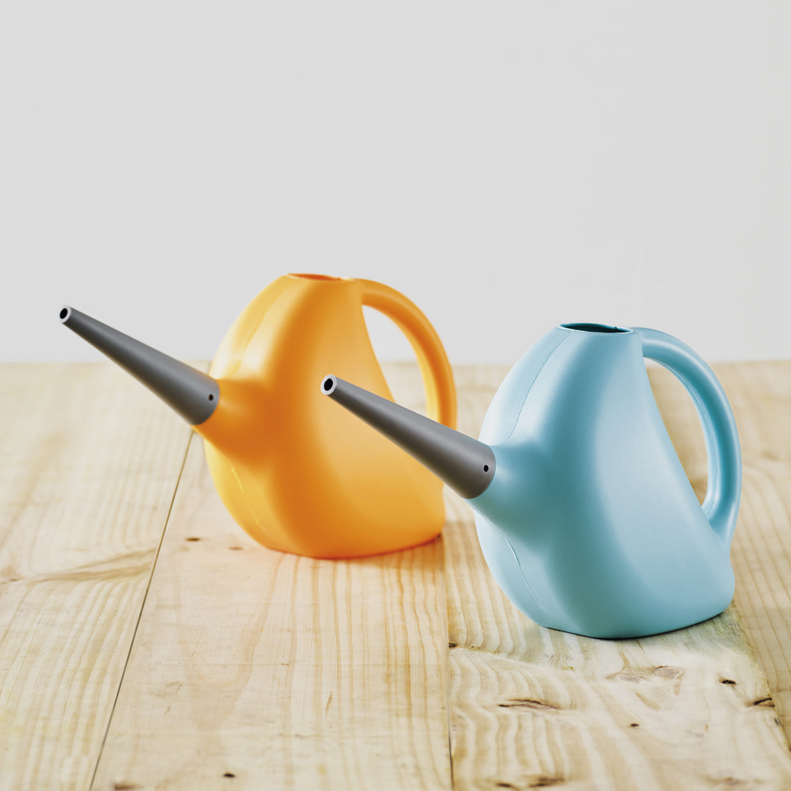 two pinocchio watering cans